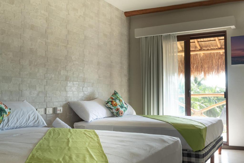 DOUBLE QUEEN SUITE WITH BALCONY MAYARI HOLBOX (2)